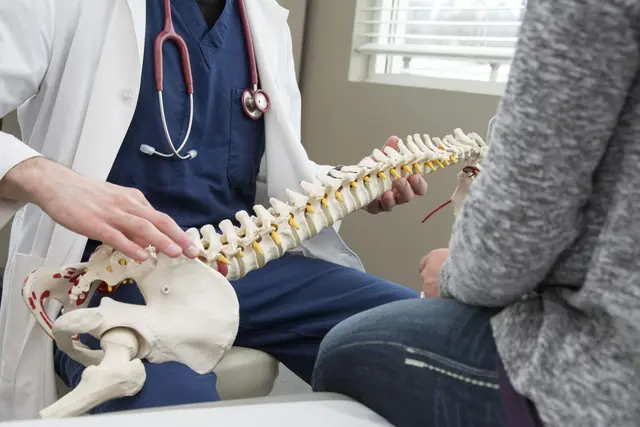 Compassionate chiropractic team welcoming a patient at Synergy Spine and Nerve Center.